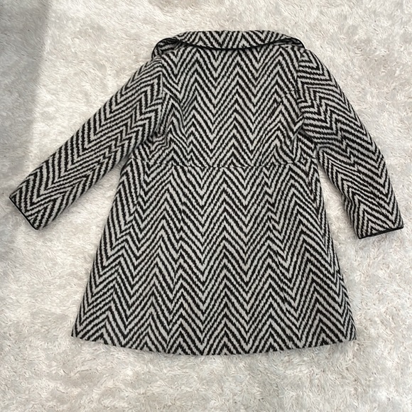 Girl feaux fur coat. 2 black buttons are missing on front. Bought at Saks. - Picture 2 of 2